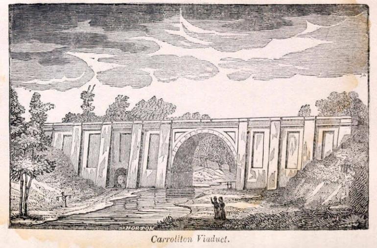 One of the earliest etchings of the Carrollton Viaduct, circa 1833. See the arched passage for carriage traffic on the far side of the bank, public domain image.