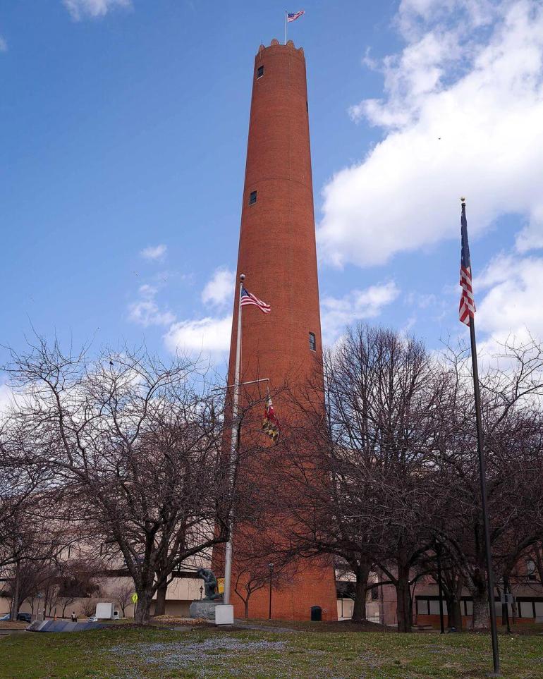 The Phoenix Shot tower, built in 1828, was used for making ammunition. Molten lead poured through colanders, would form perfect spheres as the droplets fell down the 215-foot tower into rain barrels. Public domain photograph, 2015.