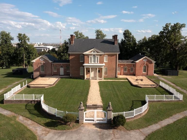 While excavating the forecourt, archeologists discovered that the original stone and wooden fence mirrored the shape of the Palladian window in the two-story Doric Portico.