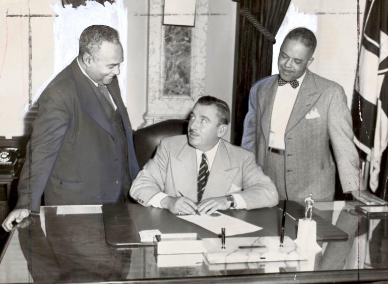 Dr. Bernard Harris, left, the first black member of the Park Board with Mayor Thomas D’Alesandro, center, and Dr. George McDonald, right, in the mayor’s office, Oct. 20, 1951.