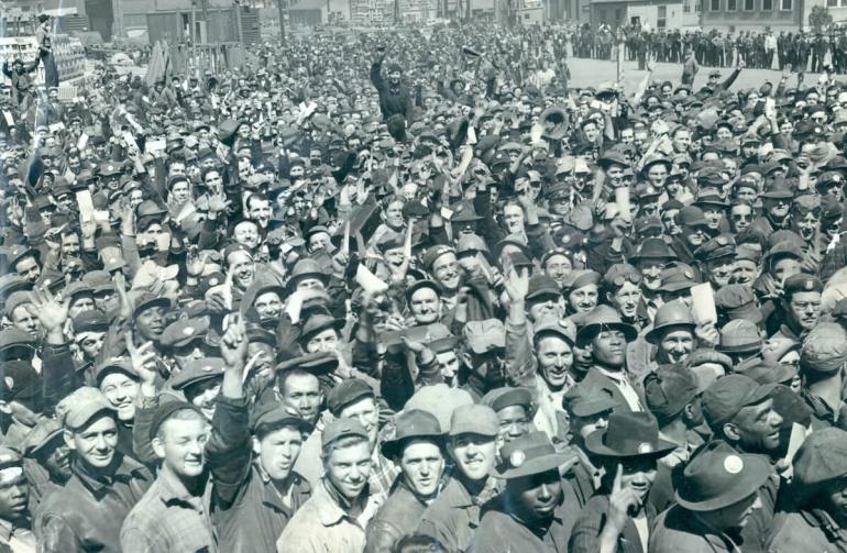 Bethlehem Steel workers, an integrated workforce, celebrate a triple launch of warships at Sparrows Point in 1942.