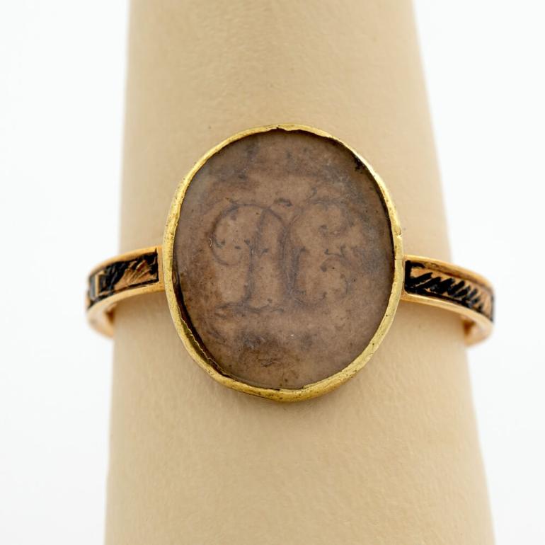 Gold and ivory mourning ring with initials D.C. written with locks of hair. It is believed to memorialize Dorothy Blake Carroll, Dr. Carroll’s first wife.