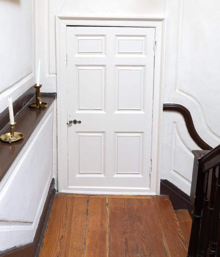 This doorway on the stair landing hid a staircase that let enslaved workers and indentured servants move from the kitchen into the house without being seen.